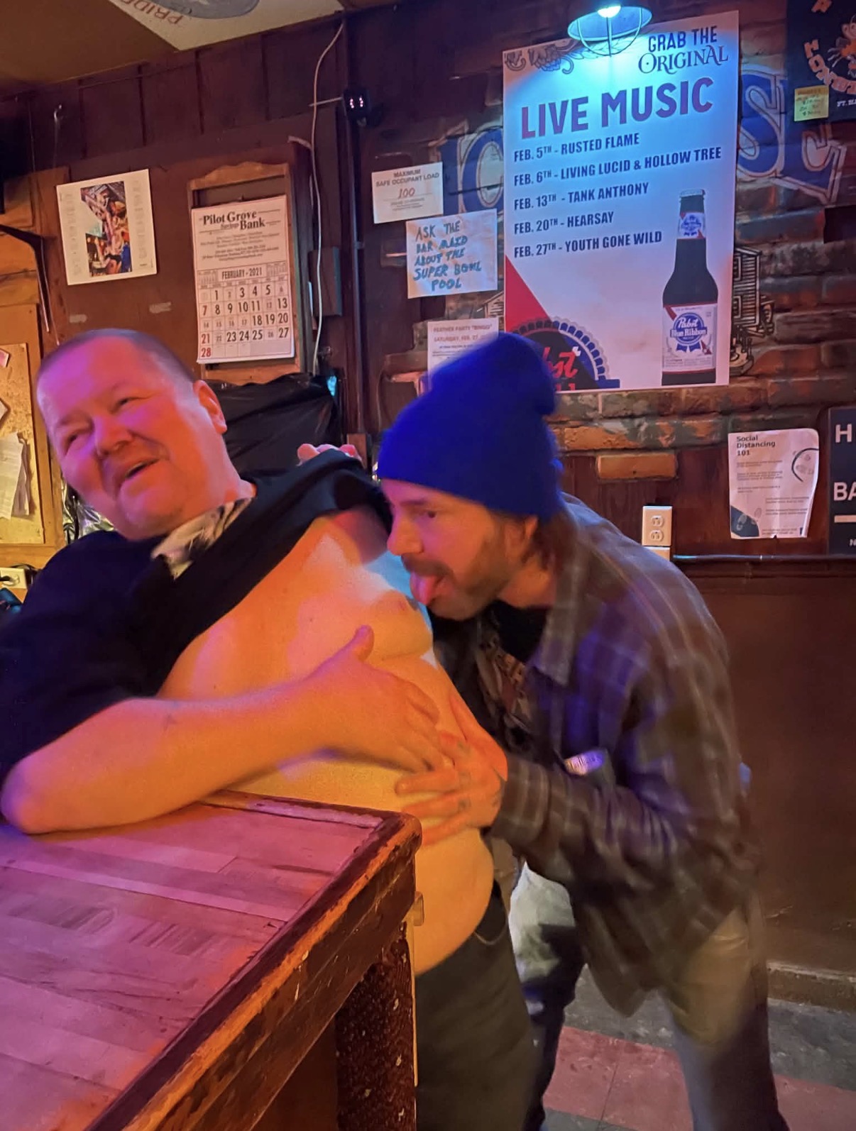 Two friends sharing a silly moment at Vinnie's