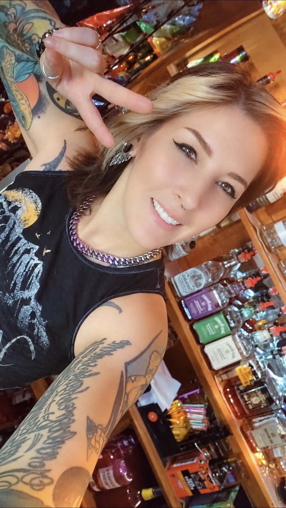 A friend smiling for a selfie inside Vinnie's