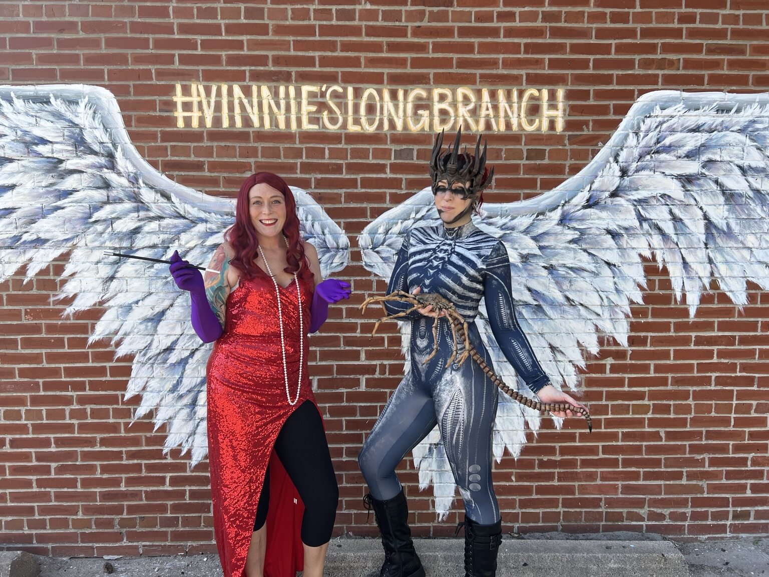 Friends in costume at the Vinnie's wings mural