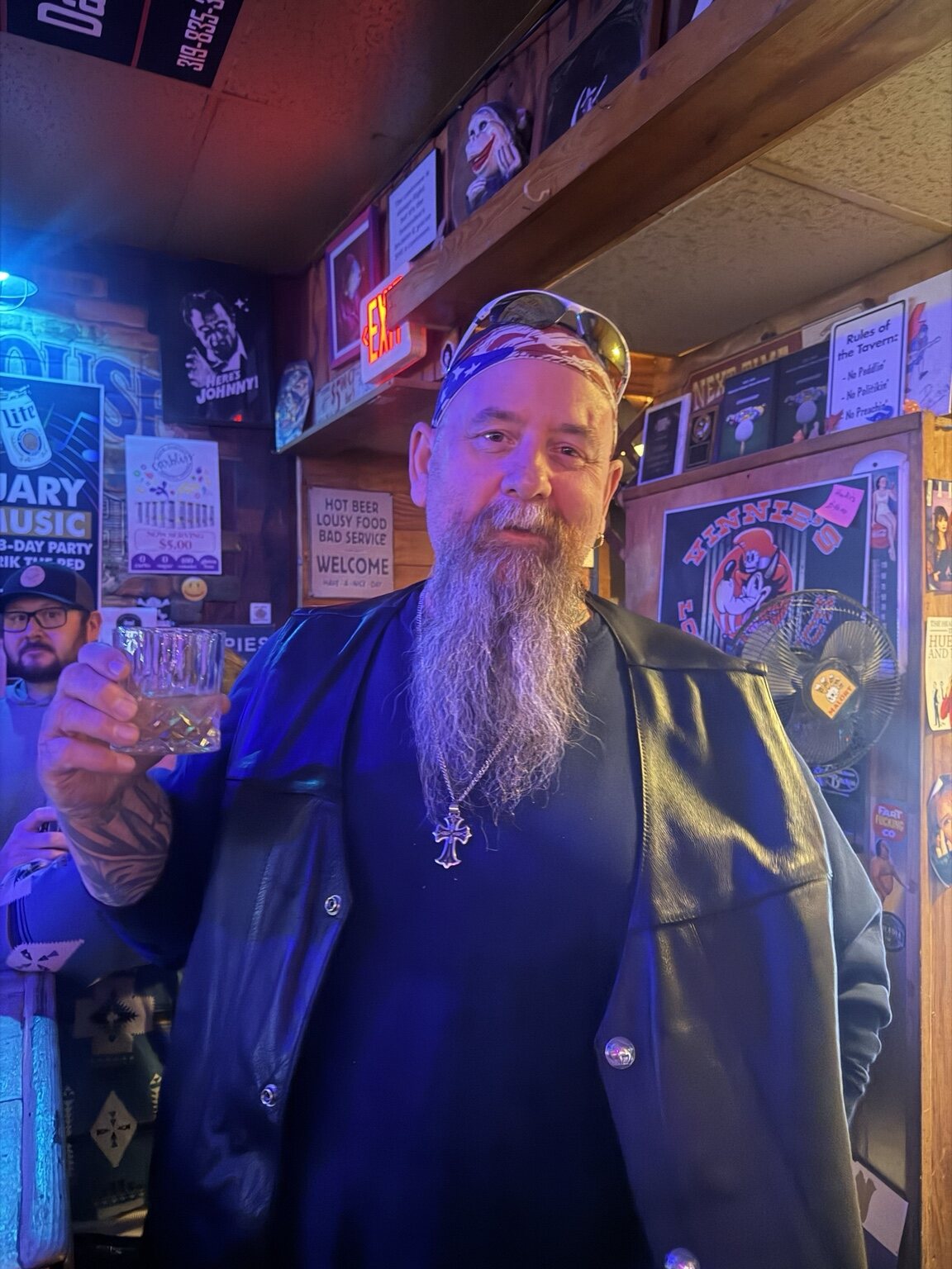 A Vinnie's regular raising a drink