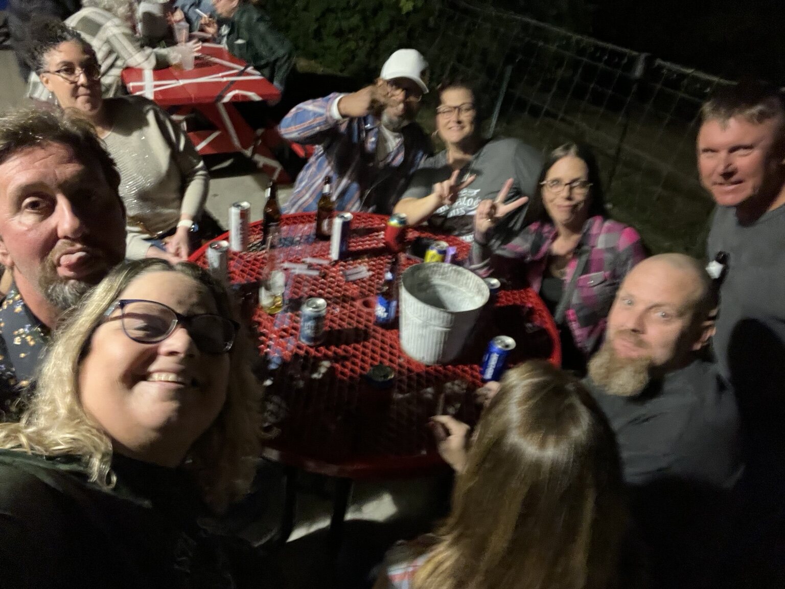Friends gathered around an outdoor table